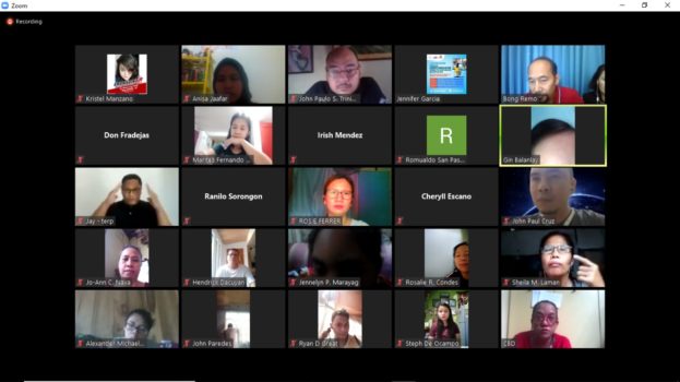 A screenshot of a computer with faces of participants of a zoom meeting in boxes